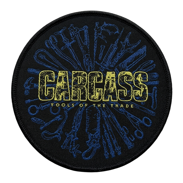 Carcass Tools of the Trade round woven patch with surgical tools design in blue and yellow on black background