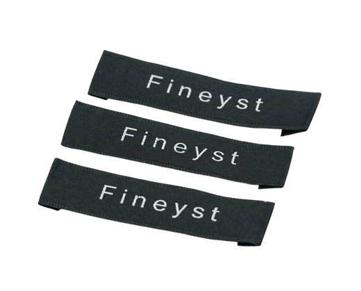 Custom satin woven labels - three black folded end tag labels with Fineyst text on satin ribbon
