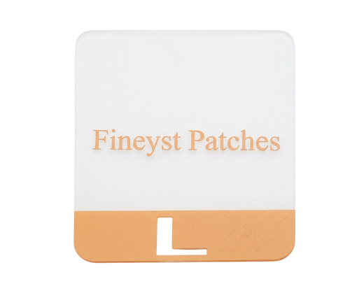 Custom TPU label - white and tan rubber patch with raised Fineyst Patches text and L size marker