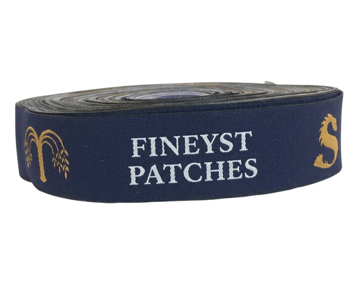 Custom woven ribbon roll sample - navy and gold fabric tape with text