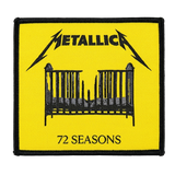 Yellow and black woven patch of Metallica’s “72 Seasons” album art, showing the band logo above a black baby crib with a broken middle.