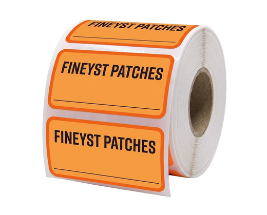 Stock labels roll - orange rectangular sticker labels with Fineyst Patches text on cardboard core