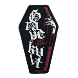 Coffin shaped woven patch with Fangs of the Night text and gothic skeletal hand design in black and red