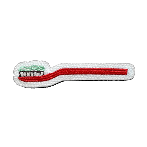 Toothbrush With Toothpaste Patch